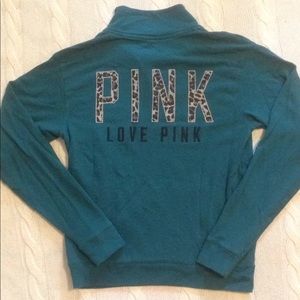 Dark teal 1/4 zip with grey leopard logo on back